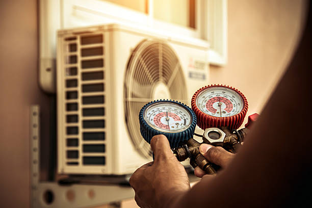 Professional Heat Pump Repair technician working in Peru, IN